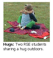 Text Box:  
Hugs: Two RSE students sharing a hug outdoors.
